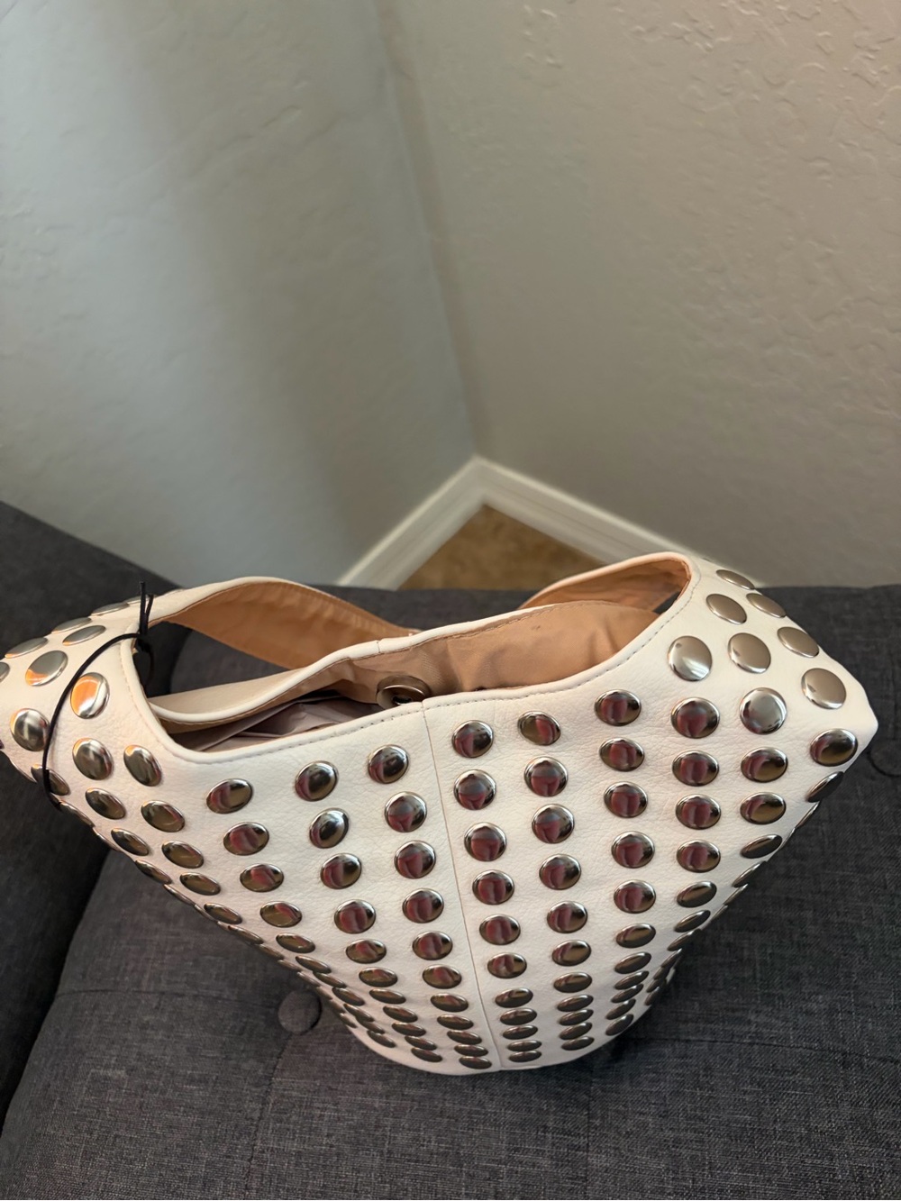 Studded White Hobo Bag with Metallic Accents